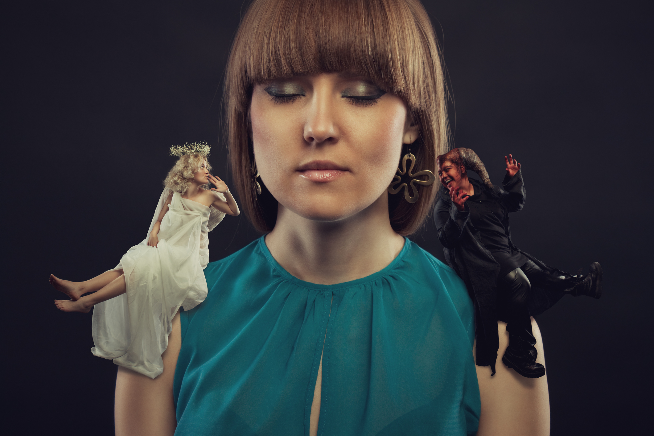 woman with angel and devil on shoulders